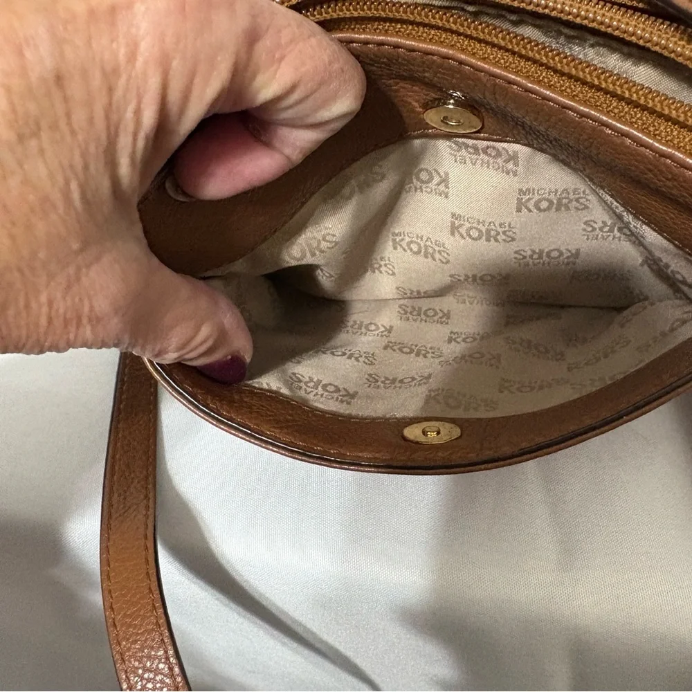 Michael Kors brown leather crossbody bag with gold-tone hardware